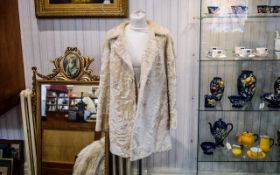 Vintage Fur Coat Cream 1960's fur coat with deep cuffs, revere collar and covered buttons.