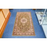 Pure Wool Kohinoor Rug, made in Belgium. Floral decoration in antique green colour.