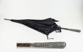 Antique Umbrella Large late 19th century umbrella of black cotton and wood construct with ornate