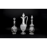 Two Victorian Glass Decanters with stoppers and star cut bases. Plus one other, (3) in total.