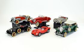 A Collection Of Diecast Model Classic Cars By Danbury Mint.