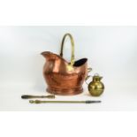 Copper Coal Scuttle with brass handle, small brass jug and fire instruments.