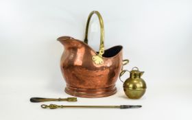 Copper Coal Scuttle with brass handle, small brass jug and fire instruments.