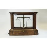 Glass cases lab scales, dating from the late 19th Century or early 20th Century.