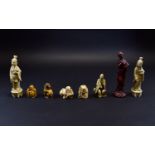 Collection of Faux Ivory Netsukes, one showing a dragon dog, the other four, Immortals,