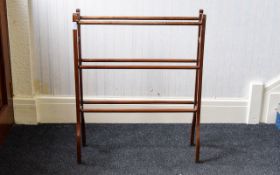 Vintage Clothes Horse Turned wood three bar clothes drier with aged patina.