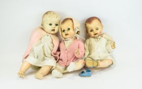 Three Vintage Dolls Three infant dolls fashioned in molded plastic with jointed limbs and closing