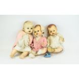 Three Vintage Dolls Three infant dolls fashioned in molded plastic with jointed limbs and closing