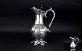 A 19th Century White Metal / Silver Plated Lidded Claret Water Jug with Scrolled Floral Decoration
