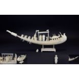 An Indian Ivory Well Carved Model of a Ceremonial Boat with Figures.