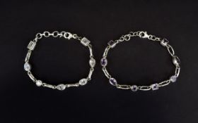 Silver And Amethyst Bracelets Two in total set with clear crystal and amethyst.