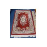 Oriental Style Rug Small rectangular rug in russet tones with oriental floral repeat pattern and