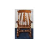 Oak Rocking Chair Large varnished oak rocking chair in rustic style with warm,