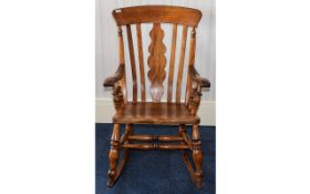 Oak Rocking Chair Large varnished oak rocking chair in rustic style with warm,