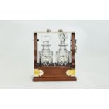 Modern Mahogany & Chrome Mounted Two Bottle Tantalus, Inset With Two Cut Glass Decanters.