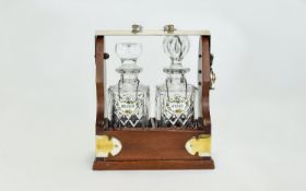 Modern Mahogany & Chrome Mounted Two Bottle Tantalus, Inset With Two Cut Glass Decanters.