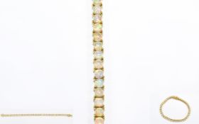 Ethiopian Opal Tennis Bracelet, round cut cabochon opals totalling 10cts,