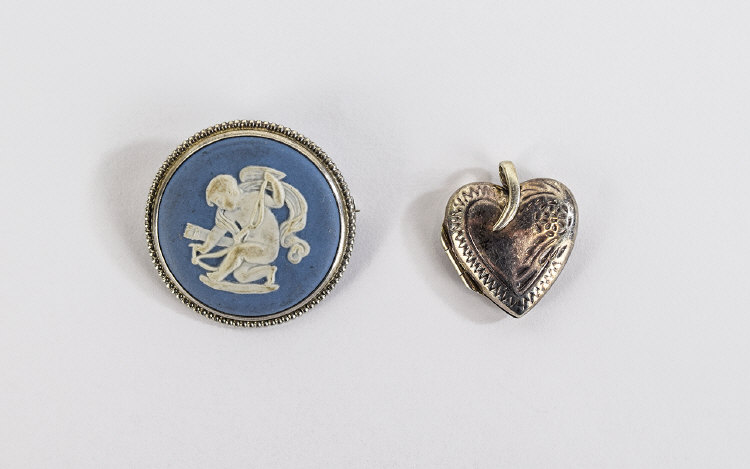 Wedgwood Pale Blue Jasper Brooch, a roundel showing Cupid preparing his bow,