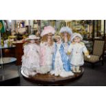 A Collection Of Porcelain Collectors Dolls Five in total, each with individual stand.