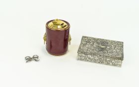 Colibri Ceramic Tabletop Lighter Claret and gilt ceramic cylindrical lighter with raised lion head