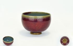 Chinese Sang De Beouf Bowl The sides applied with a densely streaked glaze thinning at the top rim.