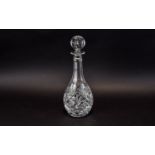 Cut Glass Decanter with star cut base and stopper.