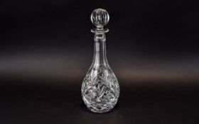 Cut Glass Decanter with star cut base and stopper.