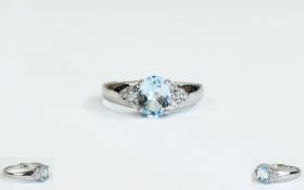 9ct white Gold Aquamarine And Diamond Cluster Ring Central Aquamarine Set Between Two Clusters Of