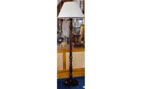 Mahogany Standard Lamp with cream shade. Height 70 inches.