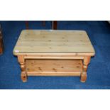 Pine Coffee Table Contemporary chunky rustic style pine table with bottom stretcher and glass top.