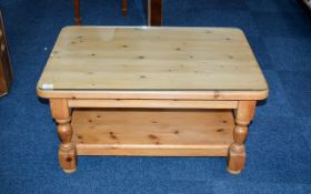 Pine Coffee Table Contemporary chunky rustic style pine table with bottom stretcher and glass top.