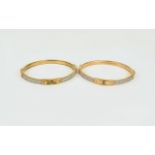 Michael Kors Bangles Two rose gold tone bangles with faux padlock detail and crystal banding