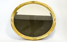 Oval Gilt Mirror with bevelled glass.