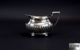 George V Silver Milk Jug with Half Ribbed Body Decoration, Standing on 4 Ball Feet.