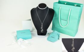 Tiffany & Co Sterling Silver Triple Drop - T & Co Pendant, with Attached 16 Inch Silver Chain.