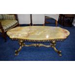 Green Onyx Coffee Table Ornate brass framed lozenge shaped table with reticulated apron.