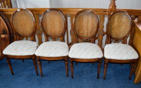 Dining Chairs A set of four dark wood di