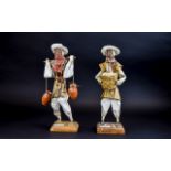 A Pair Of Mexican Glazed Paper Figures T