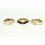 Hinged Statement Bangles Set of three gold tone metal hinged bangles with faux leather central