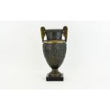 Bronzed Twin Handled Urn with classical scenes to central panel 14 inches in height.