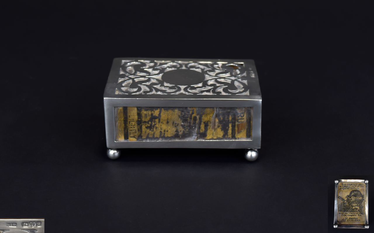 A Silver Open Worked Match Box Holder From The Victorian Period Raised on 4 Ball Feet.