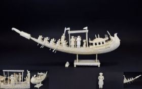 An Indian Ivory Well Carved Model of a Ceremonial Boat with Figures.