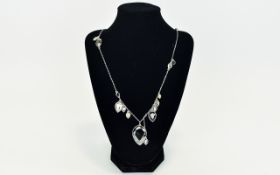 Swarovski Statement Necklace Long necklace on silver tone fine chain with 10 faceted crystals in