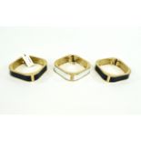 Hinged Statement Bangles Set of three gold tone metal hinged bangles with faux leather central