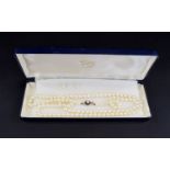 A Vintage - Nice Quality Single Strand Cultured Pearl Necklace with 9ct Gold Pearl and Garnet Clasp,