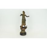 Bronzed Figure of a Classical Dressed Girl with an outstretched hand holding a flower.