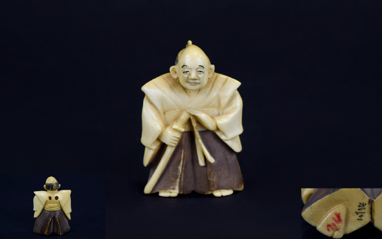 Japanese - Tokyo School 19th Century Very Fine and Signed Carved Ivory Netsuke of a Nobleman /