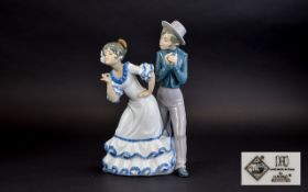 Nao By LLadro Figure Depicts a young girl and boy engaged in animated pose in traditional flamenco