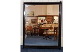 Large Bevelled Glass Mirror Early 20th century mirror in ebonised wood frame of plain form.