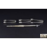 A Collection Of Plated Items to include three pairs of sugar nips and plated letter opener with